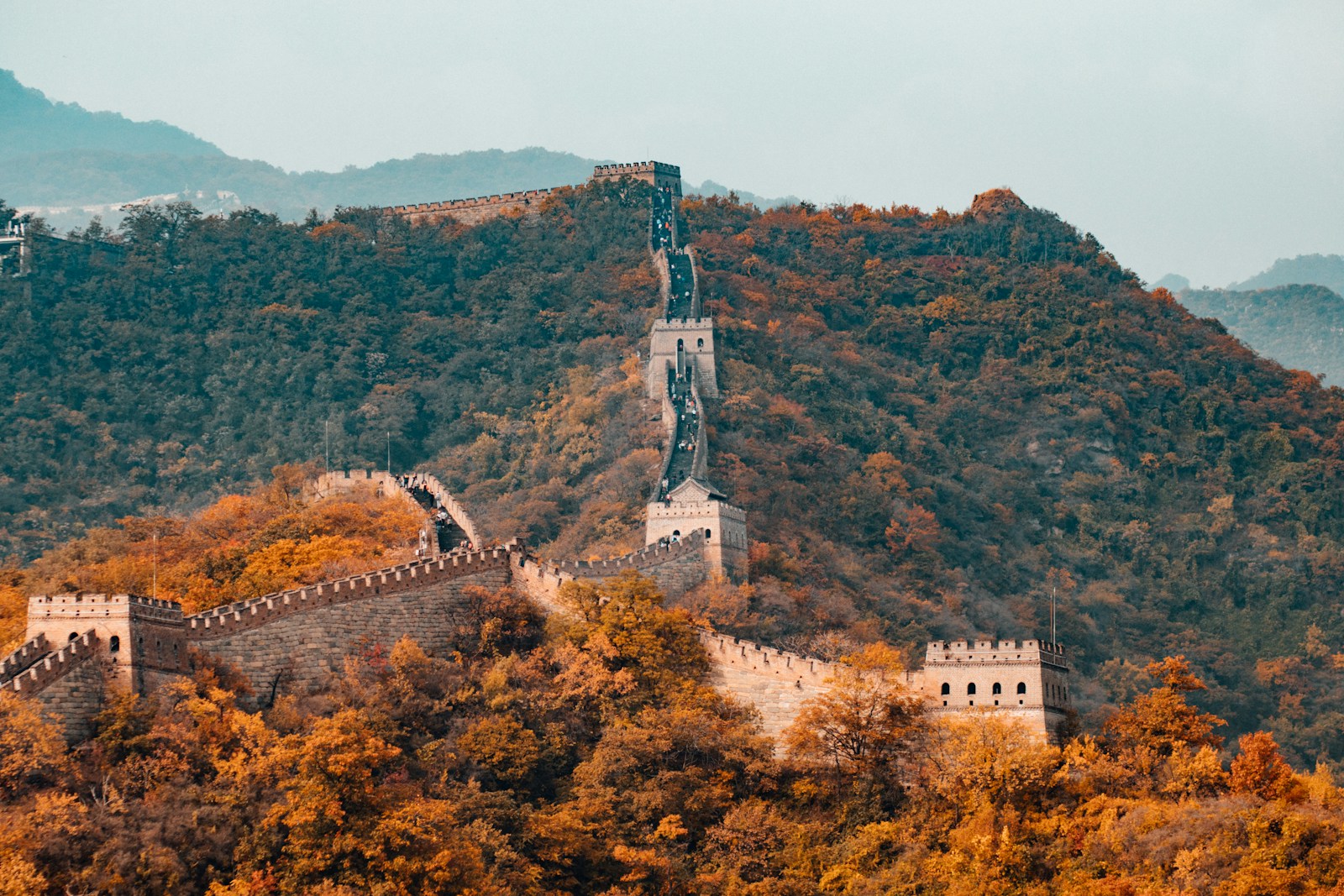 The Great Wall winding across green mountains in China